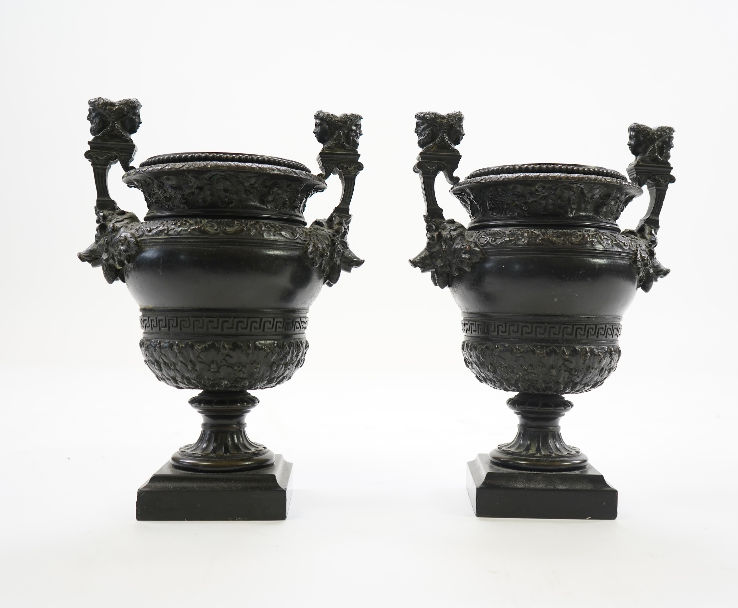 A pair of neoclassical revival bronze urns, late 19th century